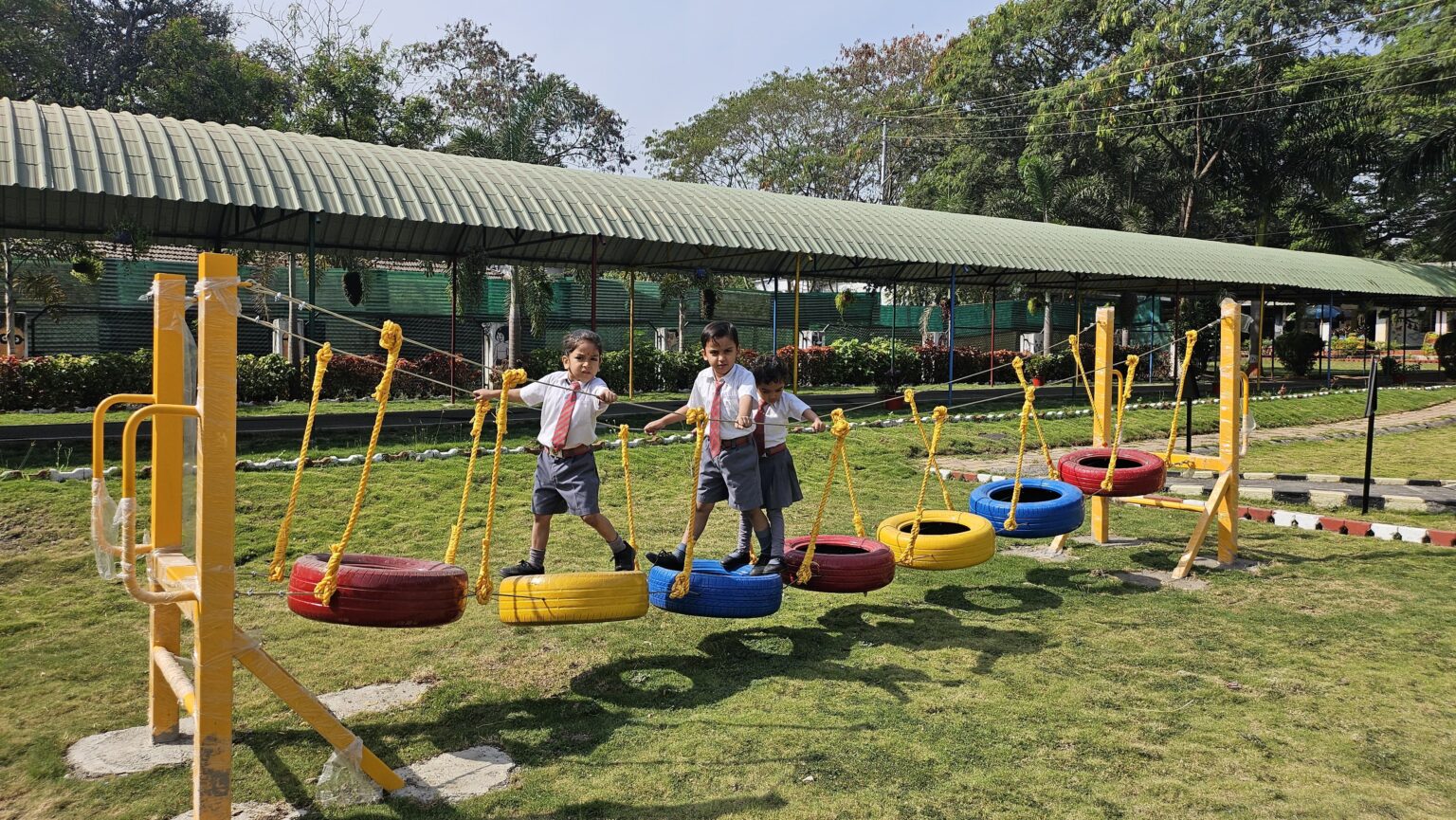 kids are playing in the garden at st john public school